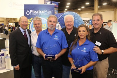 Dick Abare is awarded the Pleatco Perfect Pool Guy award next to the 2018 Pleatco Perfect Gal, Andrea Nannini.