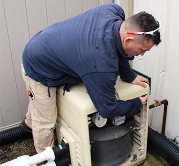 The original efficiency rating of any pool heater can change over time; a consistent maintenance record helps keep performance from diminishing. Here, troubleshooting is provided by a technician from All Seasons Pools and Spas in Orland Park, Ill.