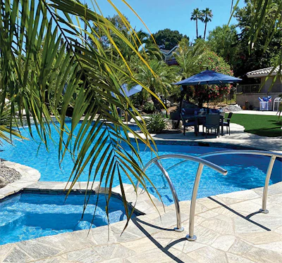 Artistic railings impart a touch of class to a knockout renovation. Photo courtesy Gardner Outdoor and Pool Remodeling.