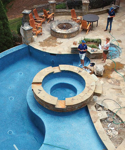 A comfortable relationship with the homeowner is a blessing on any project. Here, body language conveys the ease of communication between client and contractor. Photo courtesy J&M Pools.
