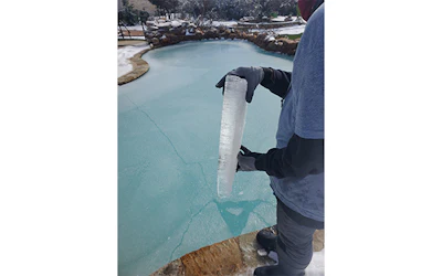 Mojica holds a sample from a customer's pool. Each customer is in a different situation, he says. Some of them have insurance and some don't.