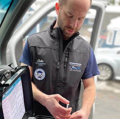 Luke from Underwater Pool Masters in Boylston, Mass., assesses pool water chemistry on location and prepares a report to be sent to the customer. (Photo credit Underwater Pool Masters)