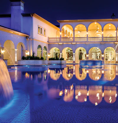 In large-scale work, grand reflections, such as these Romanesque arches, paint a picture in light on the pool surface. (Photo courtesy J. Brownlee Design)