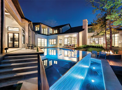 Submerged pool lights illuminate this tile wall creating a spectacular effect. (Photo courtesy Pool Environments)