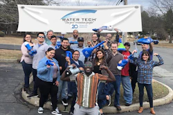 The Water Tech team celebrates at their offices this past month.