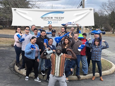 The Water Tech team celebrates at their offices this past month.