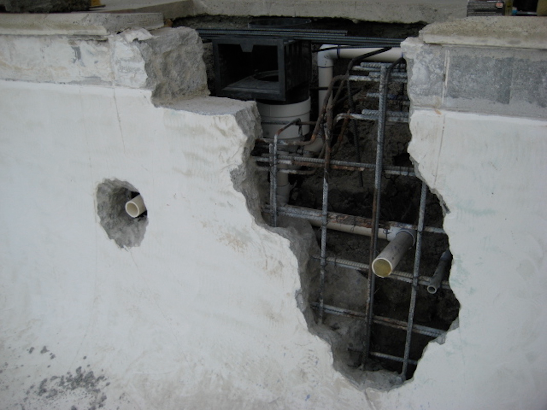Here we see extensive damage from a leak. You can see from the rust in the steel how the leak has migrated. This is an application where we were able to saw cut the coping stone above the skimmer throat and remove it.