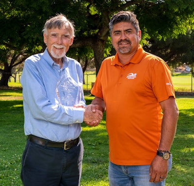 Rick English (left) receives his award with Javier Payan, Payan Pool Service.