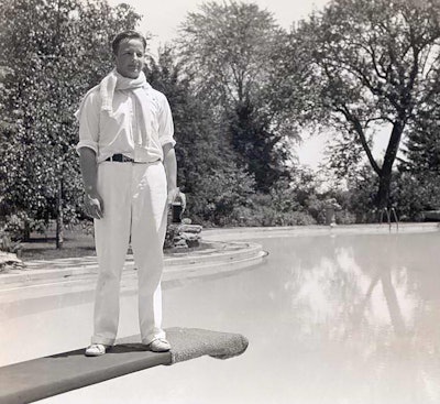 Benson Ford, son of Edsel Ford and grandson of Henry Ford, teeters above the estate’s swimming pool in 1934.