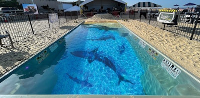 A special vinyl wrap was added over the fiberglass to depict the shadows of sharks at the bottom of the pool.