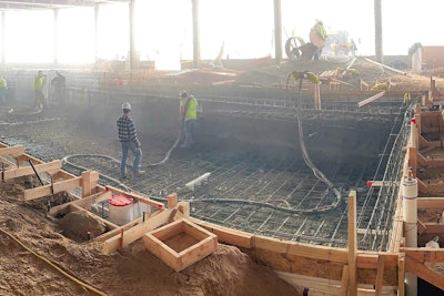 Shooting the ADA swimming pool at The Ridge at Pinehurst Assisted Living Facility, Lakewood, Colo. Significantly reduced dust in an enclosed interior allowed the contractor to use more than one nozzleman and other trades to continue working within the same space, ultimately accelerating the job.