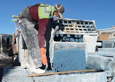 Preparations for shooting an exposed aggregate project. Note the viscosity properties in evidence here. Builders describe a “creaminess/stickiness” that aids adhesion and helps to prevent aggregate from dislodging while enhancing finishing properties.