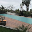 Perimeter overflow pool covered neatly by PoolSafe in San Marcos, Calif.
