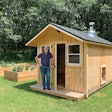 Christensen Saunas are best described as tiny buildings. This cedar sauna, the company’s most popular model, is complemented with raised flower beds.