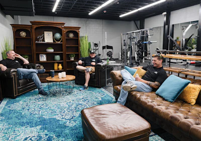 Deep-cushioned leather furniture provides a true relaxation zone where workers can connect.