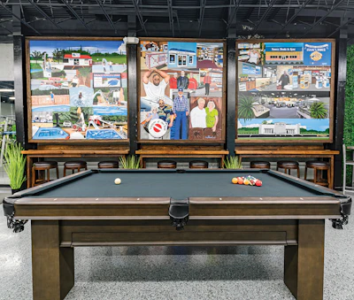Three murals serve as a focal point in the recreation facility. They tell the story of Isaacs Pools & Spas since its founding in 1978.