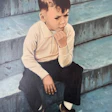 A young Eric Herman sits on the steps of the Lincoln Memorial in 1965.