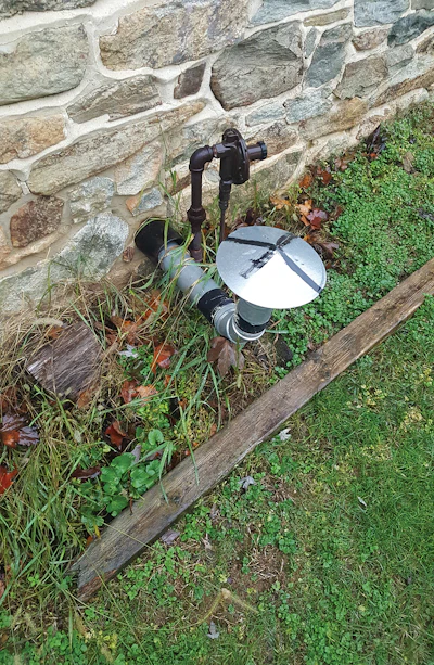 Most codes dictate that a vent must terminate at least 18 inches above the proposed snowline. If the vent is blocked by snow, carbon monoxide would back up into the occupied space. Also, the gas regulator, which has a vent, is far too close to the hot surface of the vent termination, which is a potential source for ignition.