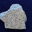 A sample of a blue pigmented plaster and pebble finish where the cement portion has lost the blue color and turned white. Note the absence of any calcium scale deposit over the pebble aggregates, which eliminates that cause of the plaster whitening effect.