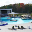 The 80,000-gallon main pool features a swim-up bar and is maintained at 87 degrees Fahrenheit year-round.
