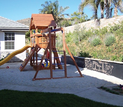 Tip: A smooth garden wall provides privacy and makes a great chalkboard surface. Apply an even stucco coat and paint with primer, then apply two coats of chalkboard paint. It's that easy to give kids a piece of the world they can decorate to their own taste.