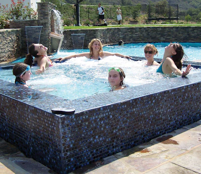 A spa provides bubbly pleasures for all ages, while a basketball court and a pool are natural complements for active play. Incorporating them all draws everyone to the backyard on a nice day.