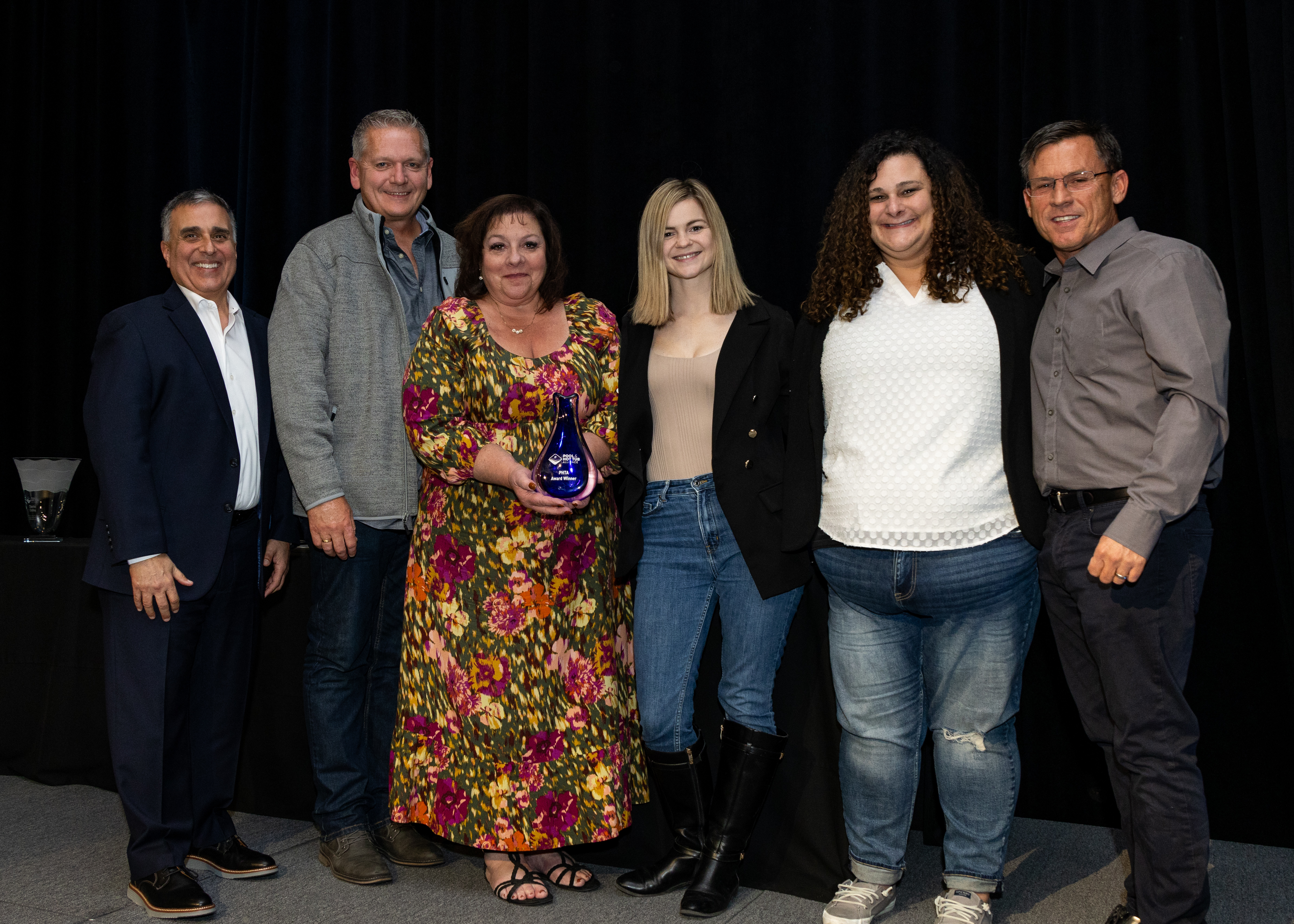 Presentation of the PHTA Chapter of the Year Award to the Midwest Chapter. L to R: PHTA Chairman Joe Laurino; Dan Lenz, vice president of All Seasons Pools & Spas, Orland Park, Ill.; Nadine Nuzzo, retail division manager, Arvidson Pools & Spas, Crystal Lake, Ill.; Melanie Brzozowski, service office manager, All Seasons Pools & Spas; Mallory Bjekich- Wachowski, business development manager, All Seasons Pools & Spas; Charlie Claffey, past chairman, PHTA.