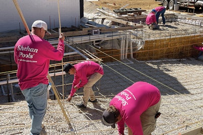 The crew from Shehan Pools working on an 18-by-39-foot gunite pool built using 160 #3 PINKBAR Fiberglas rebar sticks, and 40 #4s, same brand.