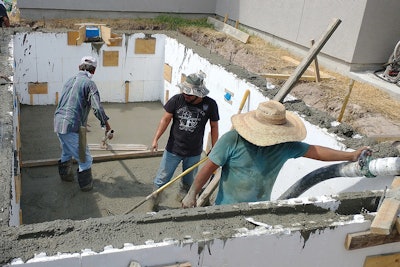 The team from DC Pools pours an ICF pool in Texas. These concrete forms will be left in the ground when the pool is finished.