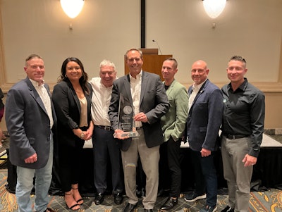 Pictured from left to right: Johnny Quest, Jerica Cyr, Jeff Ellis, Larry Newell, Jonathan Hartman, Joe Stefanyak, Benjamin Strong (Ellis & Associates Executives pictured with Dr. Larry Newell upon receiving the Ellis & Associates Lifetime Achievement Award)