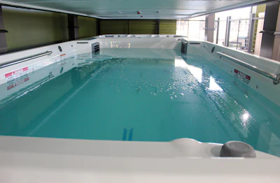 One of two swim spas ready for immediate occupancy. Water in the swim spa always helps sales.