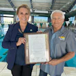 Las Vegas City Councilwoman Victoria Seaman presents Joseph Vassallo, president of Paragon Pools and founder of Float Like A Duck, with a proclamation to commemorate the many achievements of the water safety initiative and name May 2024 as Float Like A Duck and National Water Safety month.