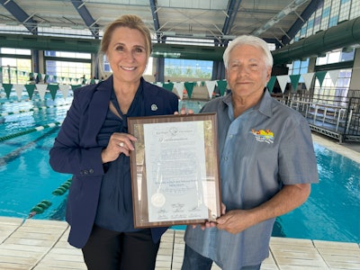 Las Vegas City Councilwoman Victoria Seaman presents Joseph Vassallo, president of Paragon Pools and founder of Float Like A Duck, with a proclamation to commemorate the many achievements of the water safety initiative and name May 2024 as Float Like A Duck and National Water Safety month.