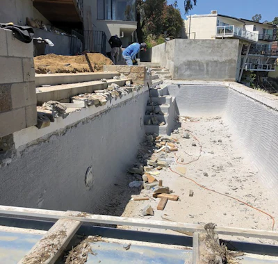 Although the pool shell was structurally sound, the project included a complete aesthetic makeover and the addition of waterproofing.