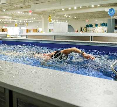 A swim spa was in full motion during the store's grand opening.