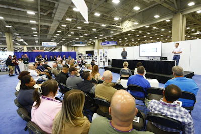 The crowd gathered to listen to each finalist’s presentation and cast their live votes for their favorite pool design.