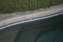 The white deposit just above the waterline in this photo is primarily the result of simple evaporation.