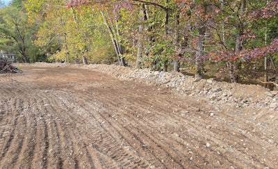 Where the water didn't take land, it deposited acres of large, densely packed rocks. Isaacs Pools & Spas lent its heavy machinery to help clear the debris for this homeowner.