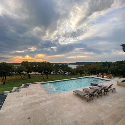 A 2024 Awards of Excellence winner in the Pools with Automatic Covers – Concrete category, this project designed by Mike Farley and built by Claffey Pools in Southlake, Texas, uses Platino limestone coping to neatly hide cover tracks and rails and provide a clean, majestic look.