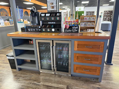A drinking station — from coffee to juice, water and sodas — is a simple way to elevate the customer's shopping experience.