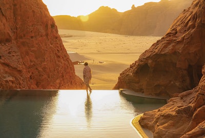 Rock pool at the Banyan Tree AlUla in Saudi Arabia. In the Saudi Arabian desert, water is only found after a rainfall, when it fills valleys or ravines and creates what is called a wadi. 'This resort's primary swimming pool design mimics those natural seasonal swimming holes.