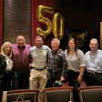 Mark Lum (third from right) is retiring in June 2025.