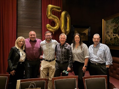 Mark Lum (third from right) is retiring in June 2025.