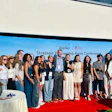 Diverse group of professionals at iGarden Strategic Partnership press conference on red carpet