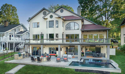 A custom pool and spa on Lake Norman makes the most of limited shoreline space, balancing relaxation with entertainment in a striking lakeside setting.