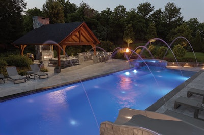 After dark, fire and water come alive: glowing edges, sparkling jets, fire bowls and more create a backyard built for drama and enjoyment.