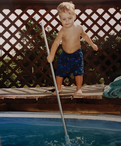 Tim Tarricone (Rich's son, now a pool service pro) cleaning his grandfather's pool. It's never too early to start learning the pool business.