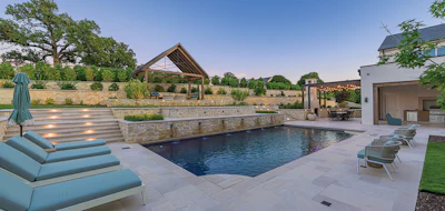 Designing a pool-spa combination with two bodies of water sharing the same equipment required independently operating automatic covers, each with walk-on lids — a solution driven by both safety needs and site constraints.