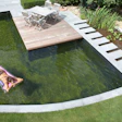 Courtesy Renolit Natural Swimming Pool With Person Floating