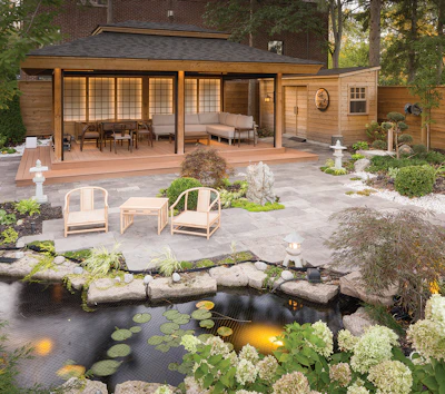 This outdoor space features two elements designed by John Kenyon: a koi pond that captures rainwater next to the pool, and a shade structure inspired by an Asian tea house.